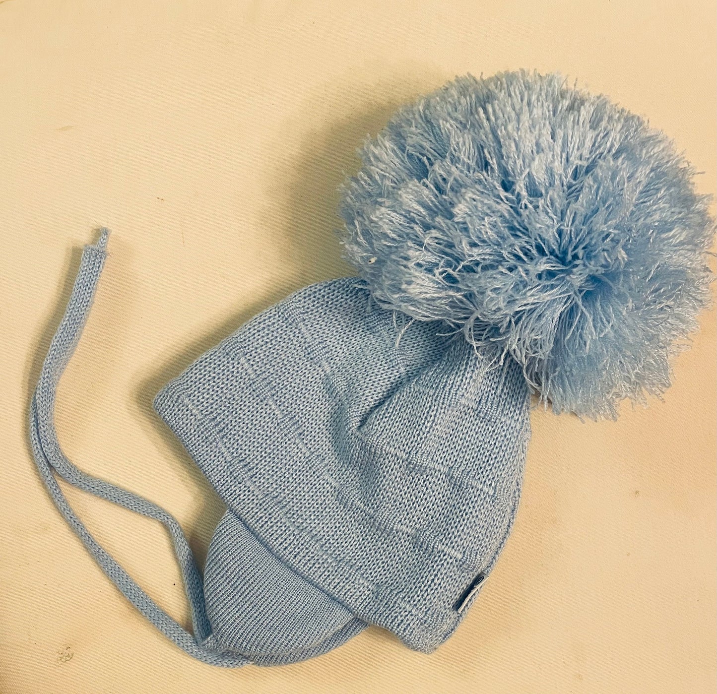 Preloved Satila blue pom pom infant hat with tie